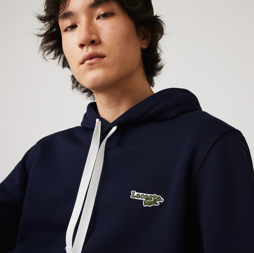 Sweatshirt à capuche Lacoste en molleton uni avec badge marine